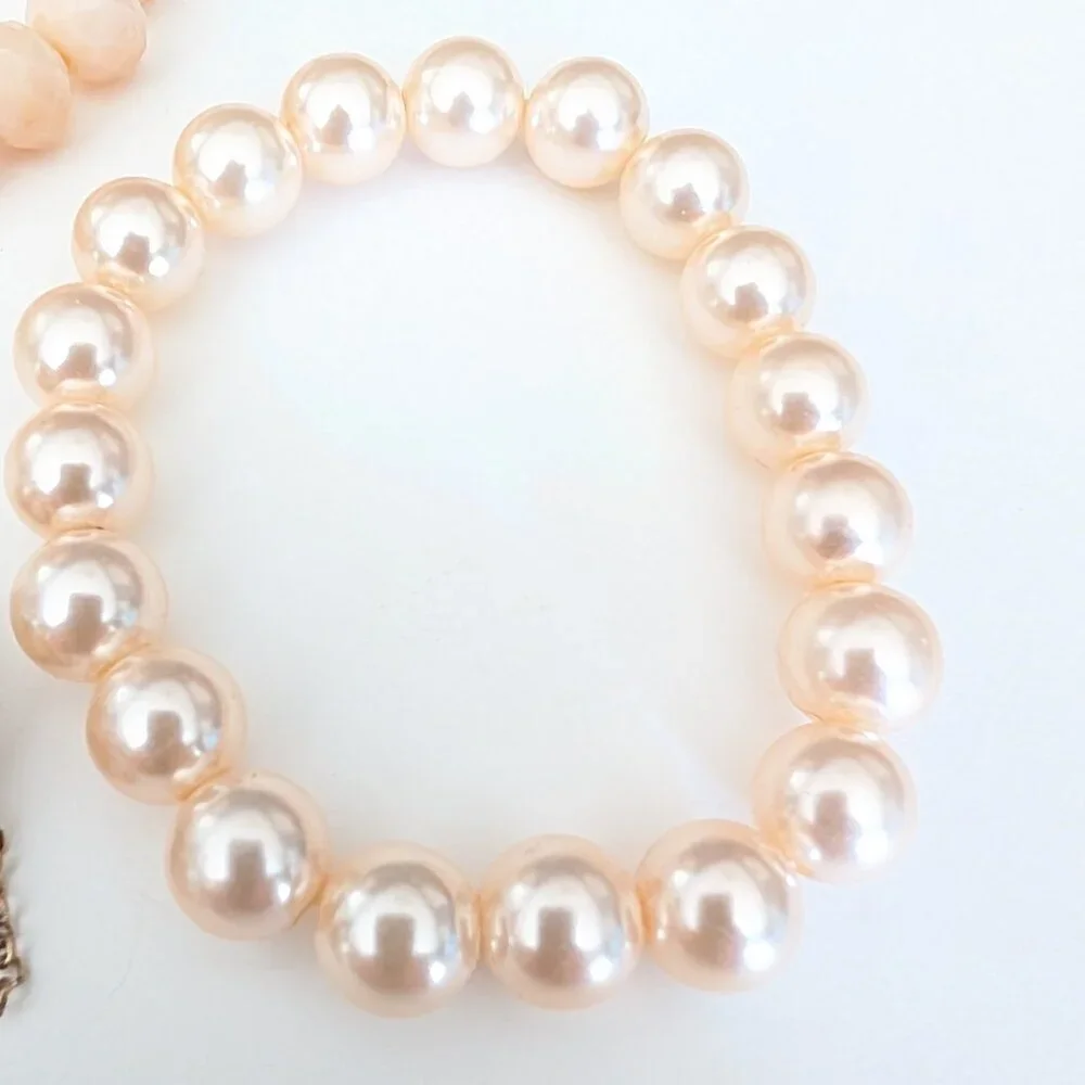 Bundle of nude and natural beaded stretch bracelets